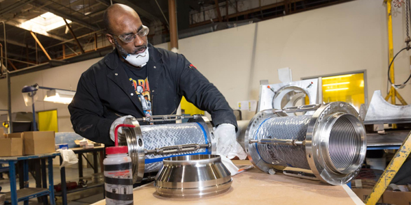 A skilled worker at FMH helps create an FMH product